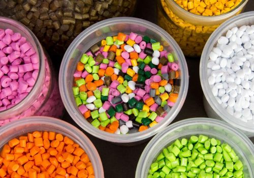 plastic-pellets-dyes-polypropylene-polyethylene-granules-measuring-container-test-tubes-laboratory-180431276